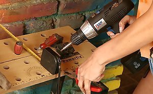 Pigtailed MILF in denim shorts operating power tools and fingering
